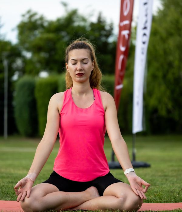 Woman in a calm yoga pose, embodying inner harmony and focus.